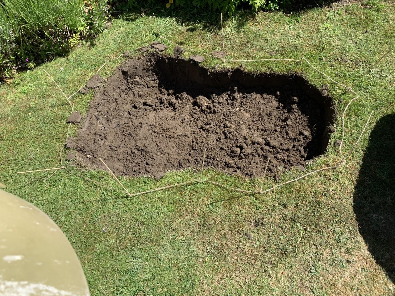 How To Build A Wildlife Pond: The Top Layer Of Soil Is Removed