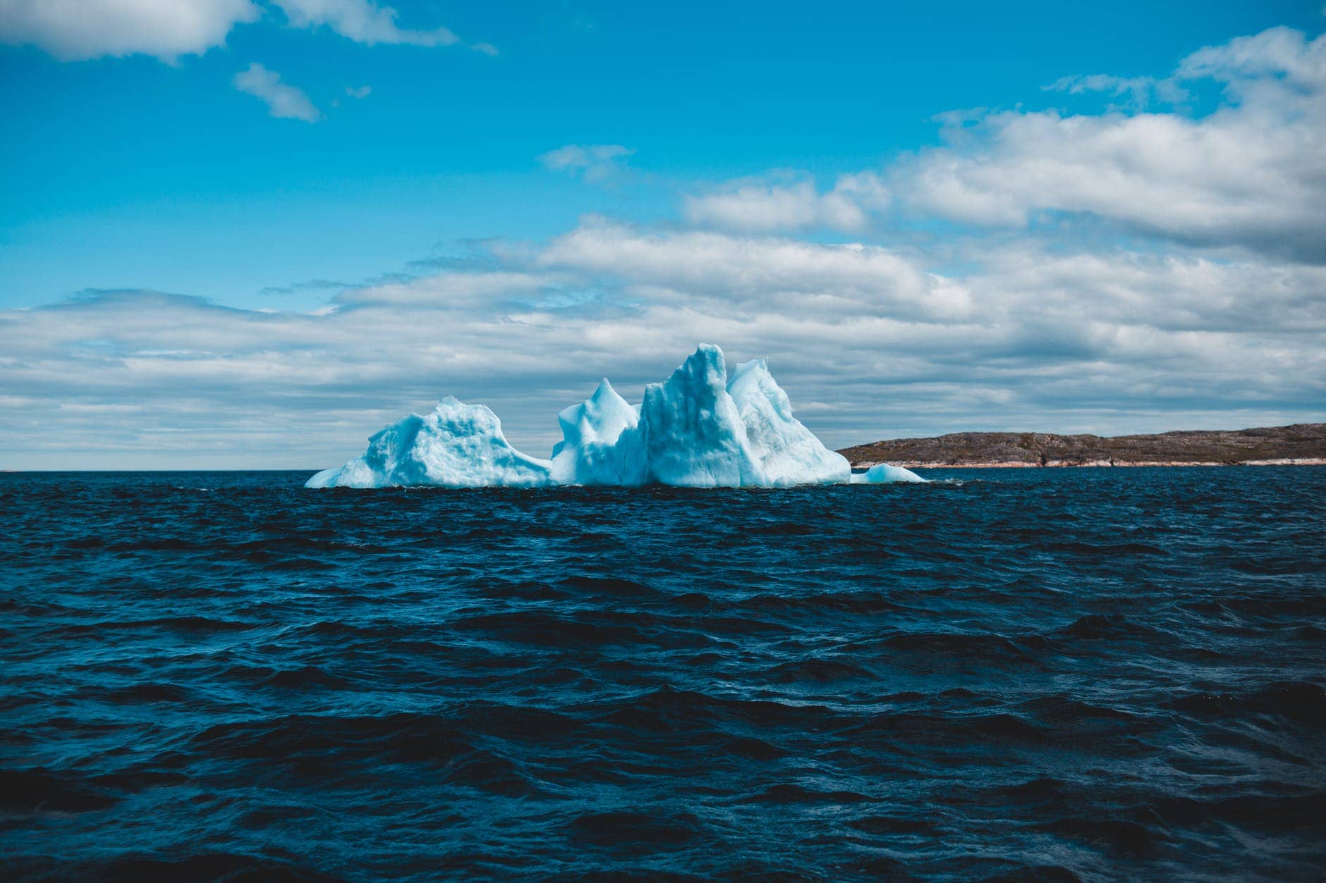 A Lone Iceberg Floats In Warming Seas